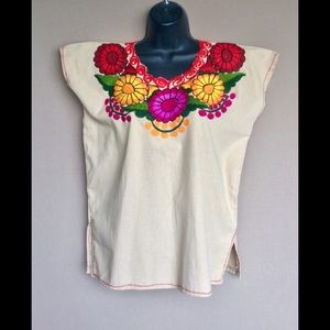 Beautiful cream blouse with flowers embroidered